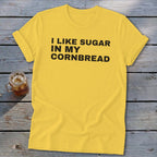 Yellow t-shirt with black text: "I LIKE SUGAR IN MY CORNBREAD"