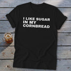 Black t-shirt with white text reading "I LIKE SUGAR IN MY CORNBREAD".
