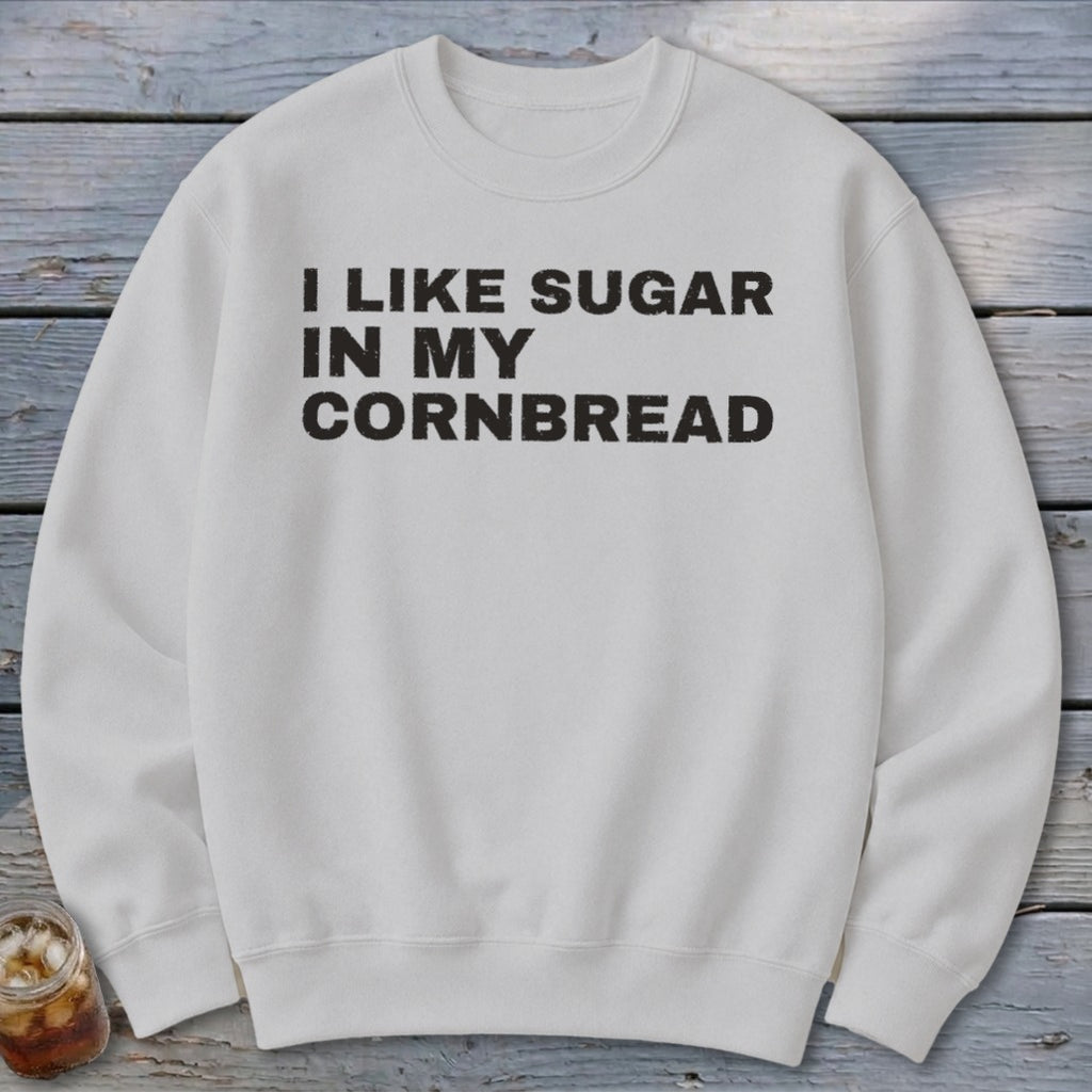 White sweatshirt with black text "I LIKE SUGAR IN MY CORNBREAD".