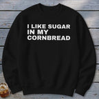 Black sweatshirt with white text "I LIKE SUGAR IN MY CORNBREAD"
