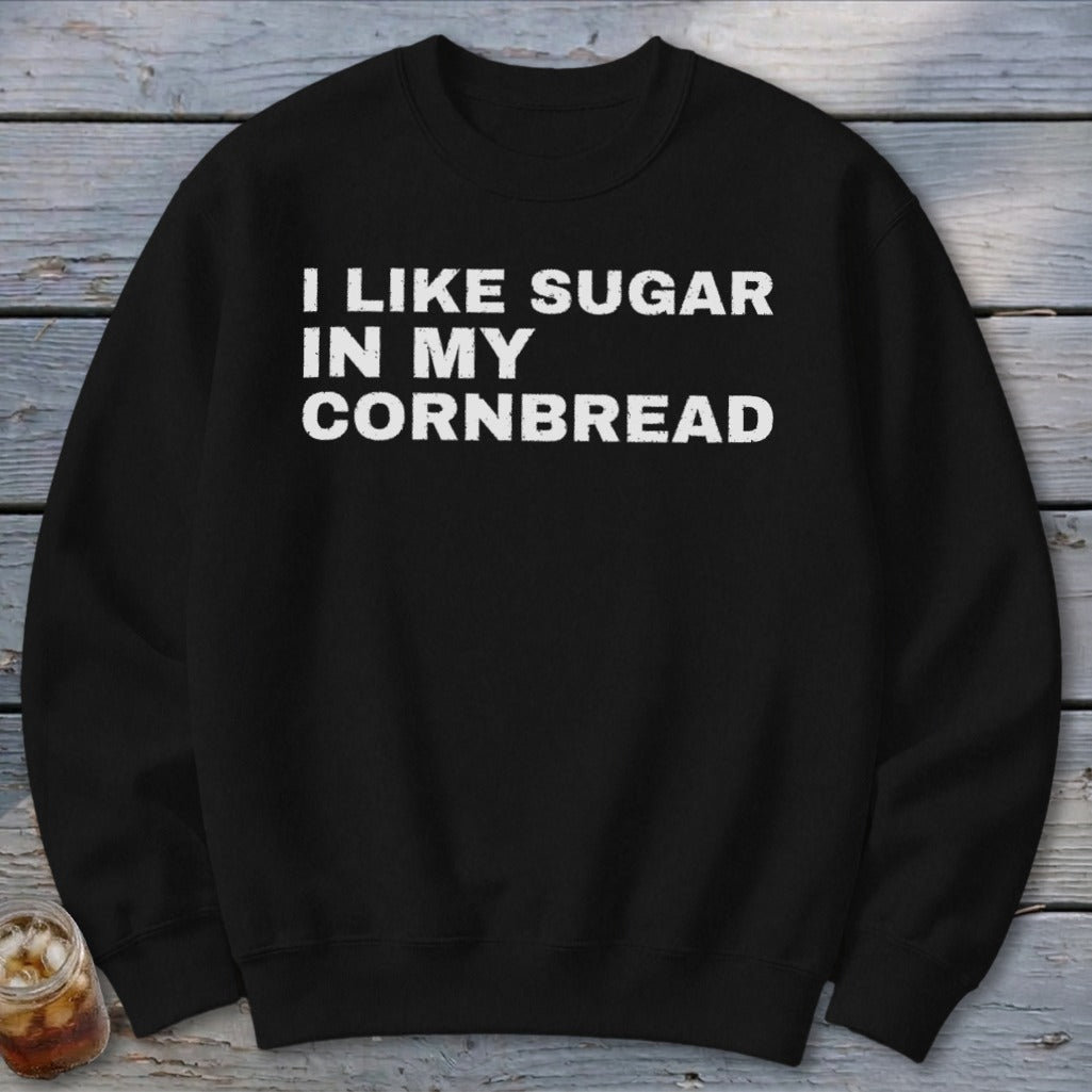 Black sweatshirt with white text "I LIKE SUGAR IN MY CORNBREAD"