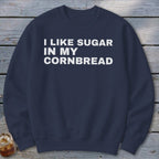 Navy crewneck sweatshirt with white text reading "I LIKE SUGAR IN MY CORNBREAD".