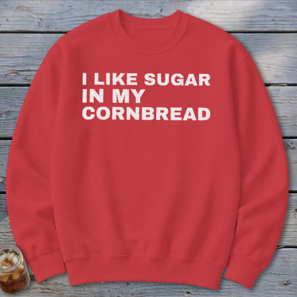 Red sweatshirt with white text "I LIKE SUGAR IN MY CORNBREAD".
