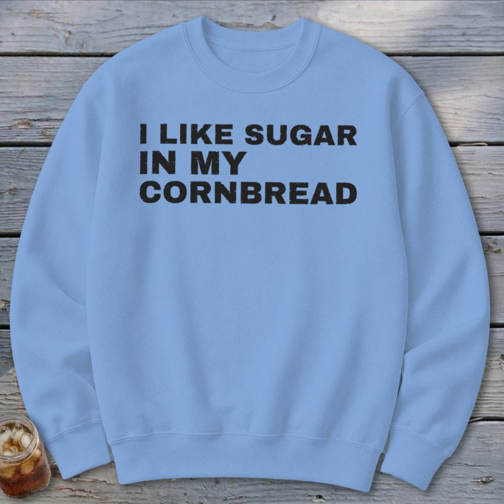 Light blue sweatshirt with black text "I LIKE SUGAR IN MY CORNBREAD".