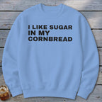 Light blue sweatshirt with black text "I LIKE SUGAR IN MY CORNBREAD".