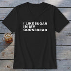 Black v-neck t-shirt with white text that reads "I LIKE SUGAR IN MY CORNBREAD".