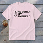 Light pink t-shirt with black text reading "I LIKE SUGAR IN MY CORNBREAD".