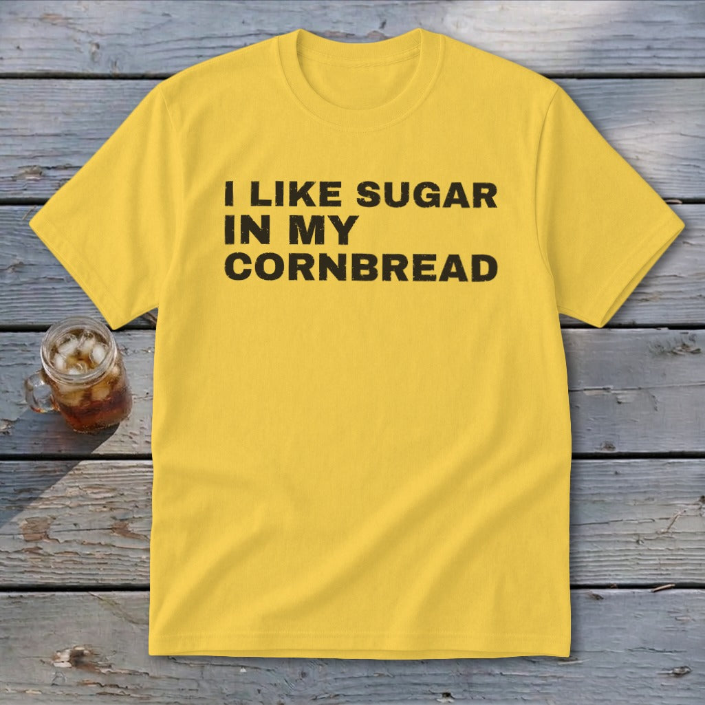 Yellow t-shirt with black text reading "I LIKE SUGAR IN MY CORNBREAD".