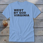 Light blue t-shirt with black text "WEST BY GOD VIRGINIA" and a glass of iced tea.