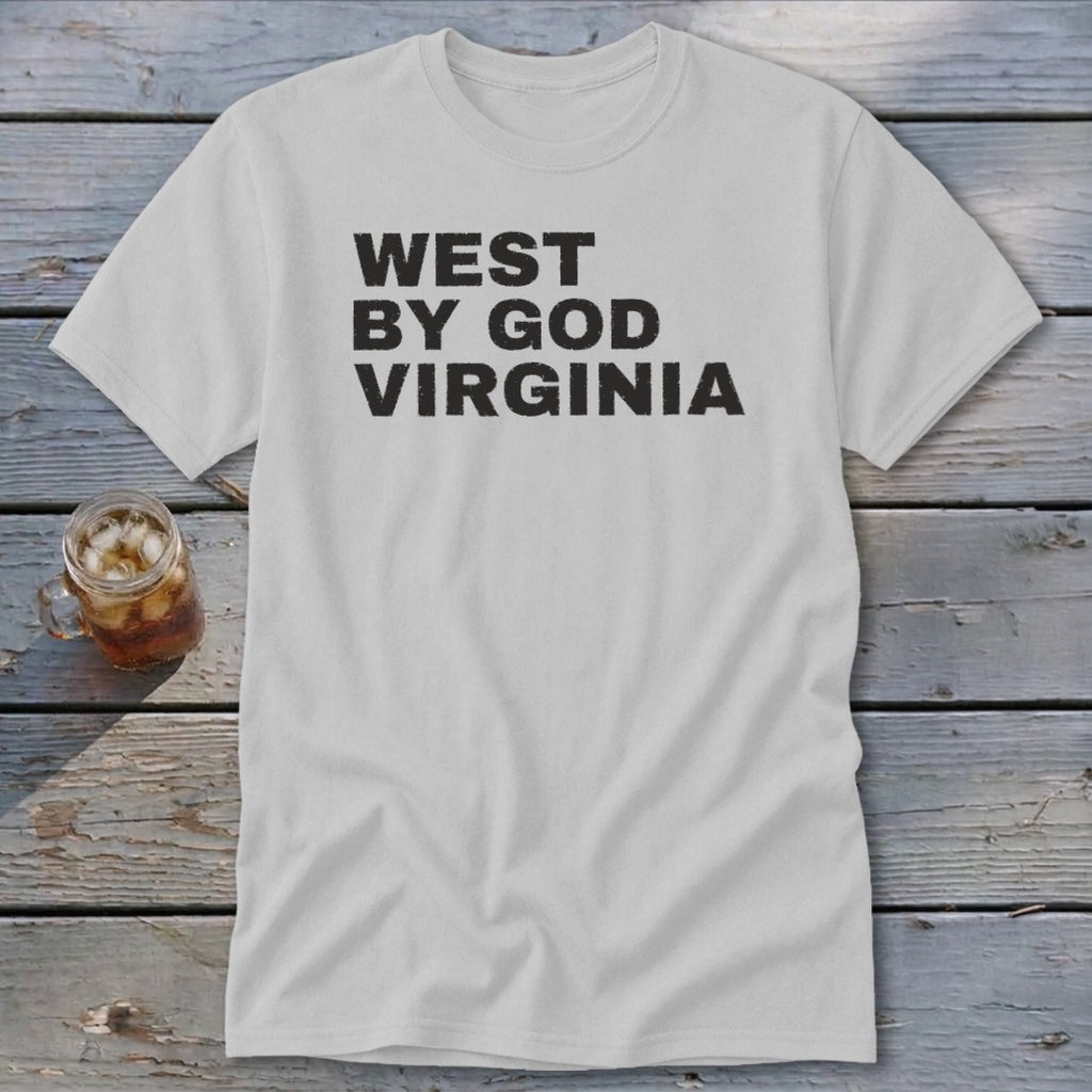 Light grey t-shirt with black distressed text reading "WEST BY GOD VIRGINIA".