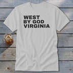 Light grey t-shirt with black distressed text reading "WEST BY GOD VIRGINIA".