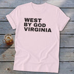 Pink t-shirt with black text "WEST BY GOD VIRGINIA" and a drink.