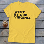 Yellow t-shirt with black text "WEST BY GOD VIRGINIA" and a glass of iced drink.