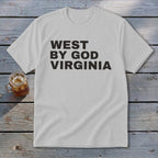 White t-shirt with "WEST BY GOD VIRGINIA" printed in black text.