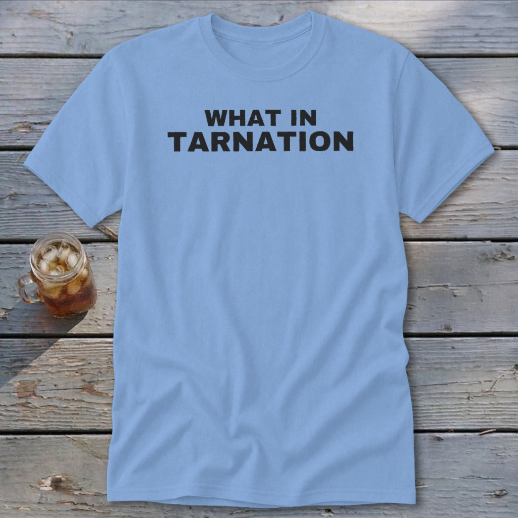 Light blue t-shirt with black text "WHAT IN TARNATION".