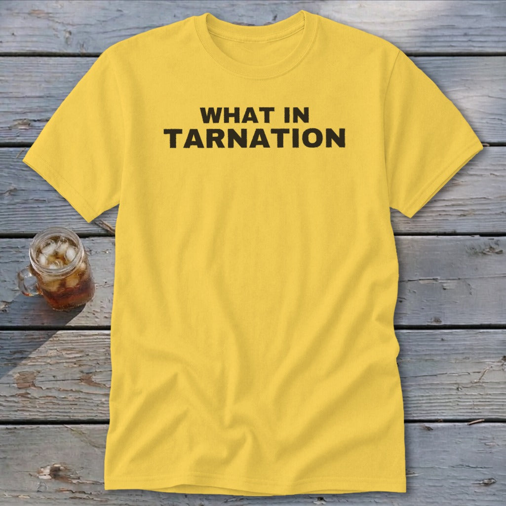 Yellow t-shirt with "WHAT IN TARNATION" text and a glass of iced beverage.