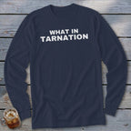 Navy long-sleeve shirt with "WHAT IN TARNATION" text in white.