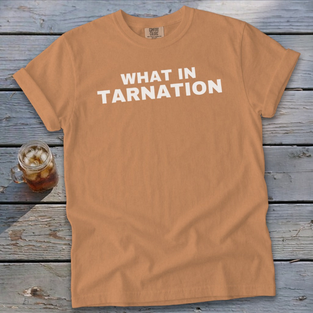 Orange t-shirt with "WHAT IN TARNATION" text and a glass of iced tea.