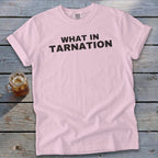Light pink t-shirt with black text reading "WHAT IN TARNATION."
