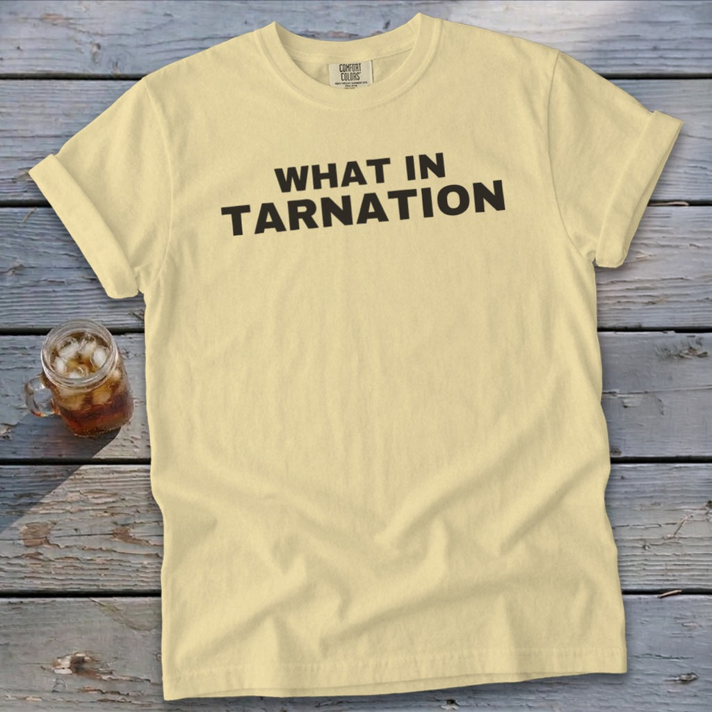 Yellow t-shirt with black text that says "WHAT IN TARNATION".