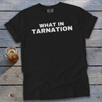 Black t-shirt with white text "WHAT IN TARNATION" and Comfort Colors tag.