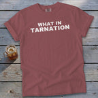 Rose t-shirt with white text "WHAT IN TARNATION".