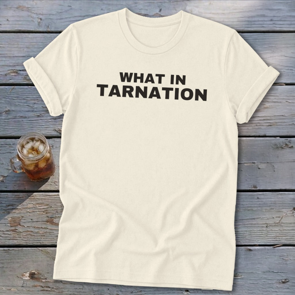 Cream t-shirt with "WHAT IN TARNATION" in bold black text.
