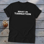 Black t-shirt with white text that reads "WHAT IN TARNATION".