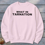Pink crewneck sweatshirt with "WHAT IN TARNATION" in black text.
