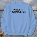 Light blue crewneck sweatshirt with black text reading "WHAT IN TARNATION".