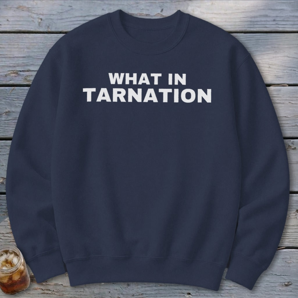 Navy sweatshirt with "WHAT IN TARNATION" text in white.