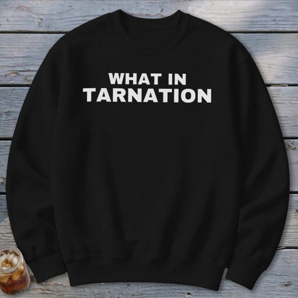 Black sweatshirt with white text reading "WHAT IN TARNATION".
