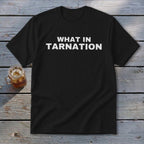 Black t-shirt with white text that reads "WHAT IN TARNATION"