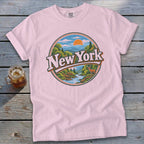 Pink t-shirt with a circular New York graphic featuring a landscape, deer, and sun.