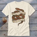 Cream t-shirt with coiled snake graphic and banner text "Respect the Mountains Watch Your Step."