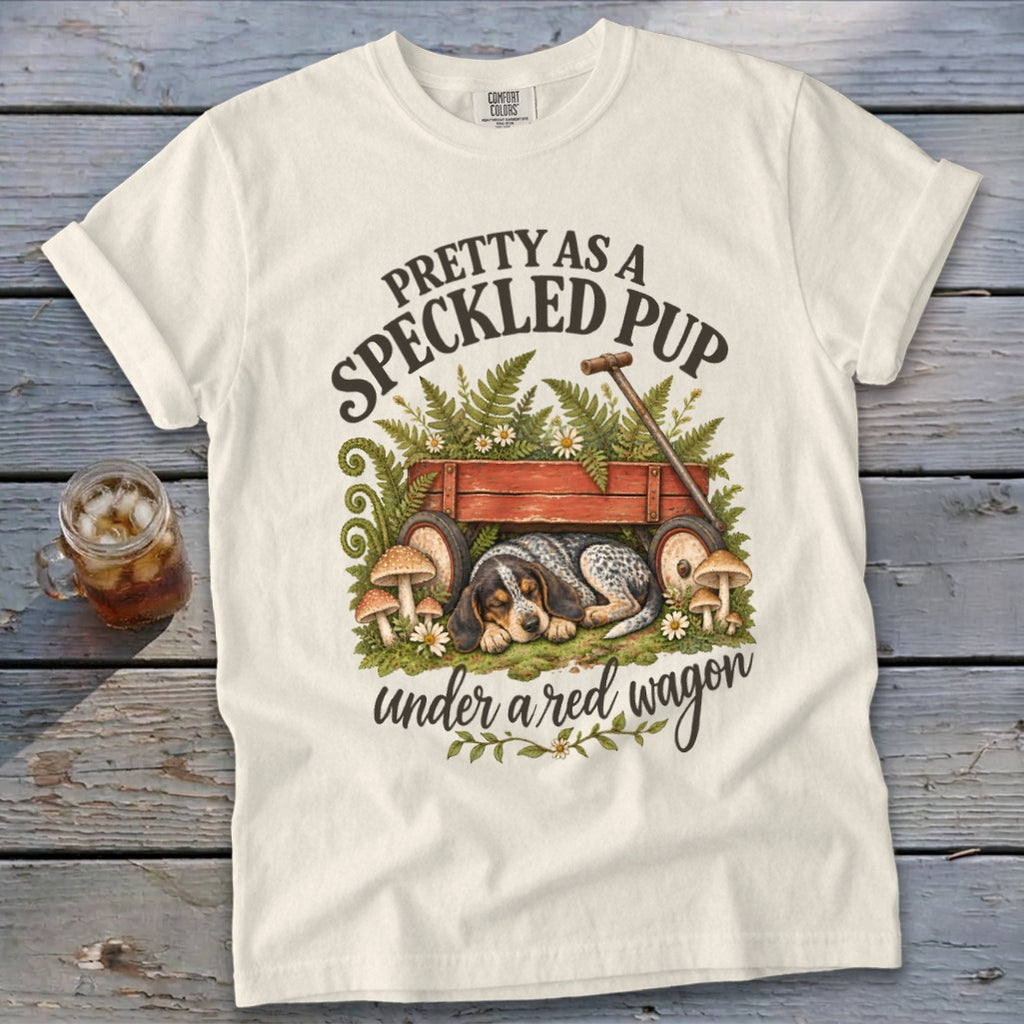 Cream t-shirt with "Pretty as a Speckled Pup under a red wagon" text and dog art.