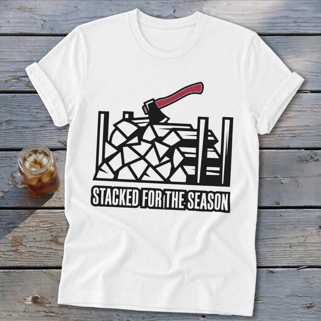 White t-shirt with graphic of stacked firewood and axe, text "STACKED FOR THE SEASON".