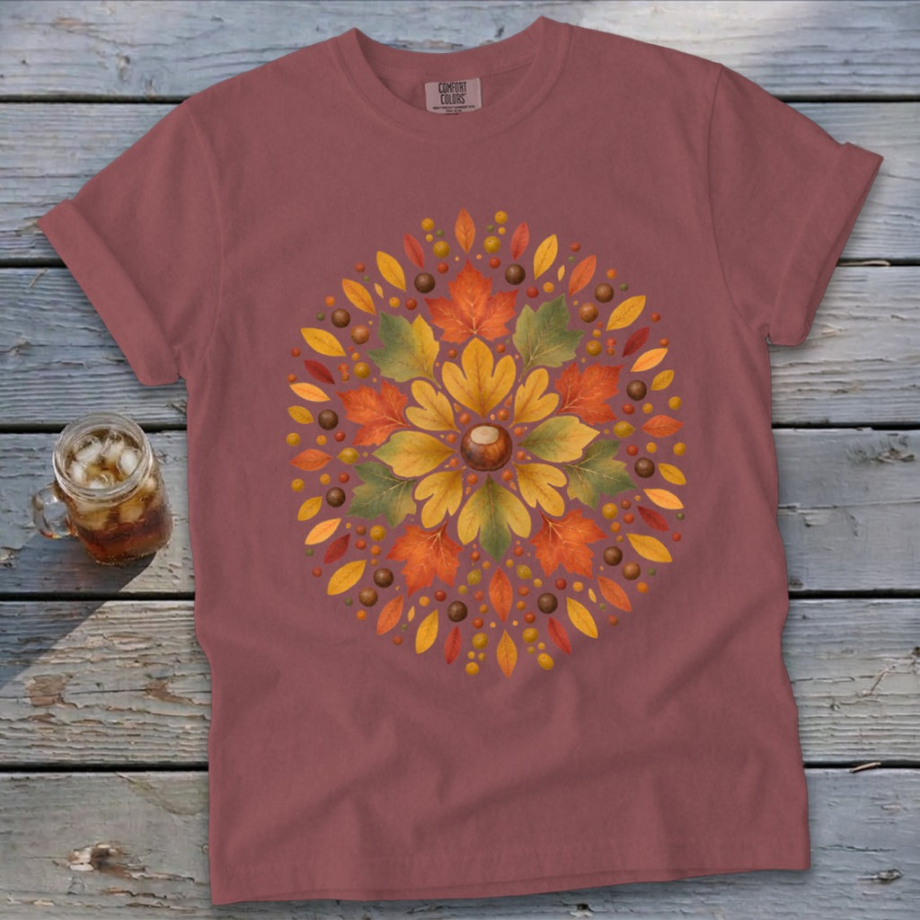 T-shirt with central autumn leaf and acorn mandala design.