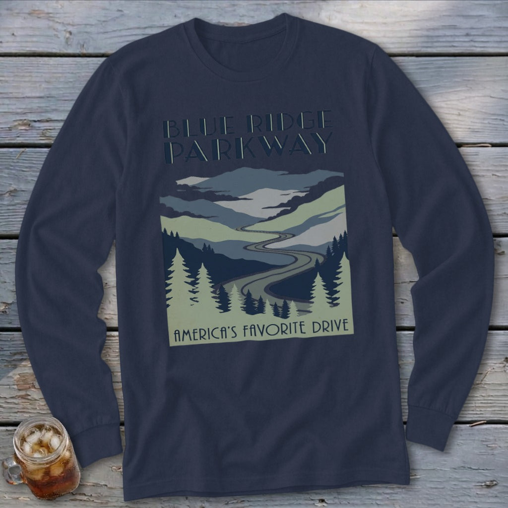 Dark blue long-sleeve t-shirt with a Blue Ridge Parkway mountain graphic and text on a wooden background.