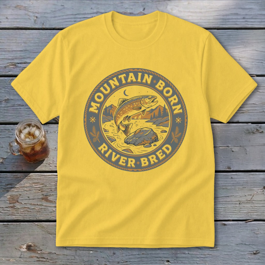 Yellow t-shirt with "Mountain Born River Bred" circular logo featuring a trout jumping from a river.