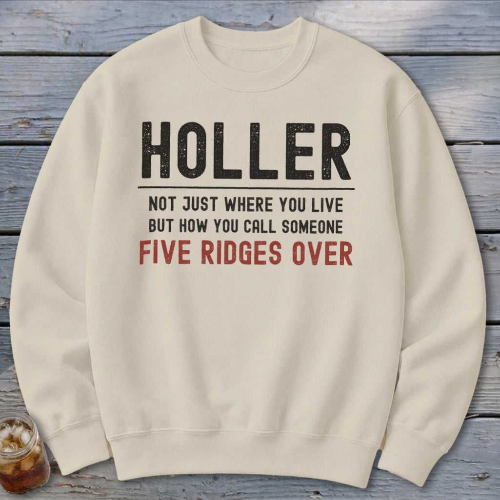 Cream sweatshirt with "Holler not just where you live but how you call someone five ridges over" text.