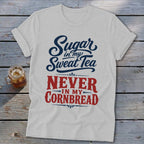 A light gray t-shirt featuring the blue and red text Sugar in my Sweat Tea Never in my Cornbread.