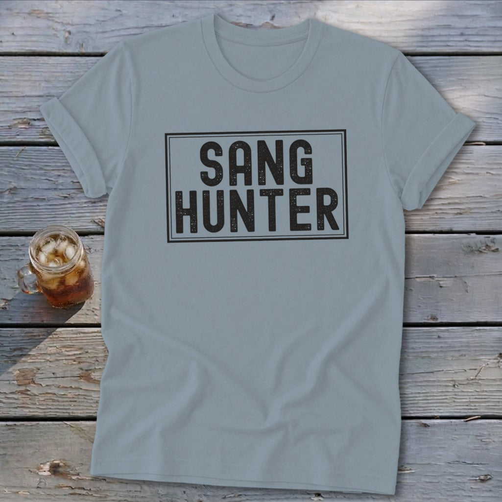 Light blue t-shirt with black text "SANG HUNTER" in a rectangular box.