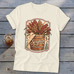 Barrel with sorghum stalks and cursive "Sorghum" text on a cream t-shirt.
