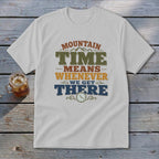 White t-shirt with "Mountain Time Means Whenever We Get There" graphic.