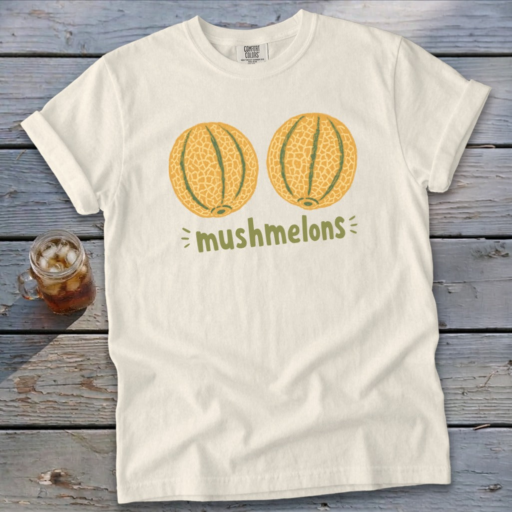Cream t-shirt with "mushmelons" text and two stylized cantaloupe melons.