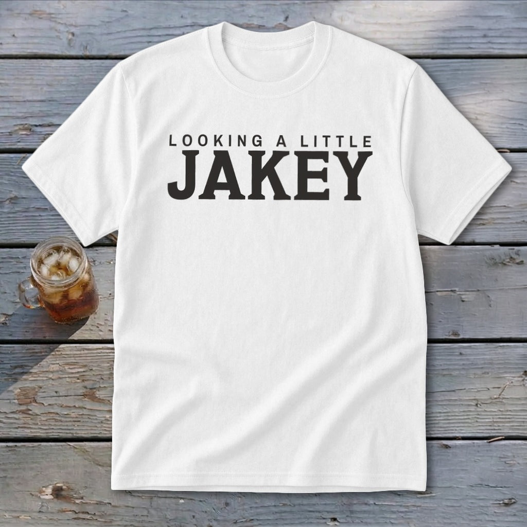 White t-shirt with black text reading "LOOKING A LITTLE JAKEY"
