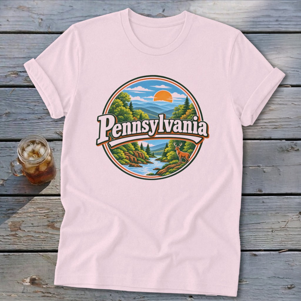 Pink t-shirt with circular Pennsylvania mountain and river landscape graphic.