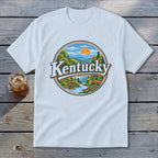 White t-shirt featuring a circular graphic of Kentucky landscape with deer and mountains.