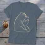 T-shirt with detailed illustration of a bear sitting and blowing dandelion seeds.
